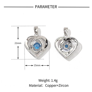 Detail view of silver heart pendant with blue zircon center and size measurements