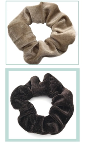 Detailed view of brown velvet scrunchies showing soft plush texture and elastic band