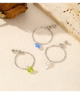 Detail of adjustable S925 silver link chain rings with colorful crystal pendants