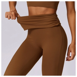 Detail view of high-elasticity fabric and tummy control waist on yoga flare pants
