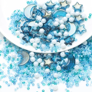 Detailed view of blue star and moon beads with seed bead set for DIY jewelry making