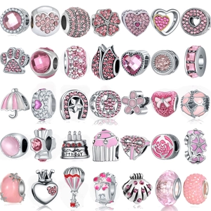 Pink and silver DIY charm collection with hearts, flowers, and sparkling zircons