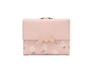 Detail of pink floral PU leather wallet featuring a decorative gold-toned metal clasp