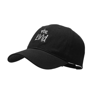 Classic black cotton baseball cap featuring white 'be kind' embroidery with heart detail