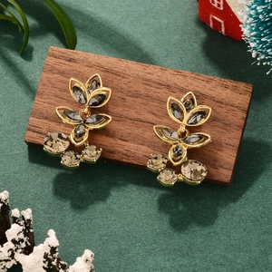 Exquisite gold earrings with smoky crystal clusters in a festive Christmas holiday setting