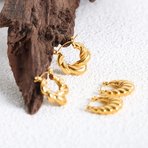 Golden geometric knot earrings in twisted stainless steel with a high-polished finish