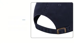 Detail of adjustable metal buckle and navy cotton twill fabric on the baseball cap