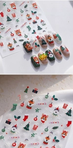 Macro detail of 3D embossed Christmas dog nail stickers with vibrant holiday patterns
