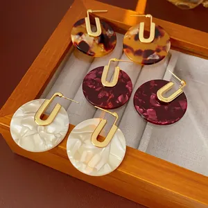 Vintage gold plated acetate hoop earrings in tortoiseshell and marble patterns