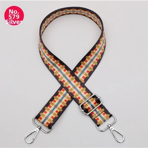 Adjustable wide replacement strap with silver metal hardware and colorful geometric patterns