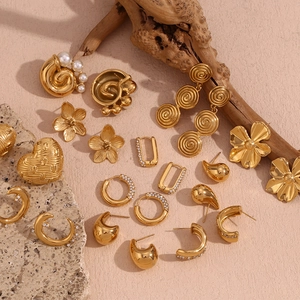 Macro shot of vintage 18K gold-plated earrings with pearls and crystal inlay details