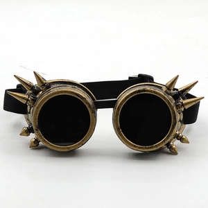 Detail of steampunk goggles with bronze frames, decorative spikes, and elastic headband