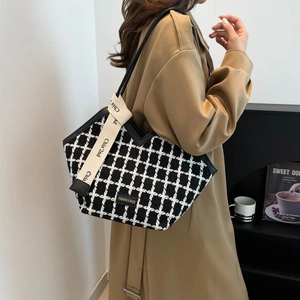 Large black and white plaid tweed tote bag with a trendy wide lettered shoulder strap