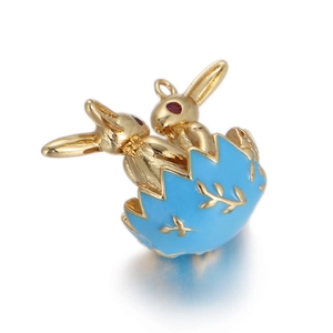 Detailed close-up of a gold bunny charm in a blue enamel egg for jewelry making