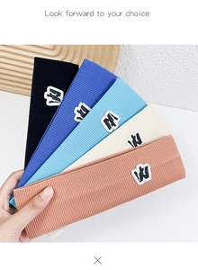 Detailed knit ribbed texture of sports headbands in five vibrant colors with embroidery