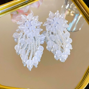 Detailed macro view of beaded pearl earrings with frosted acrylic beads and s925 silver pins