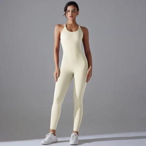 Close-up of cross back design on a cream-colored one-piece yoga jumpsuit for women