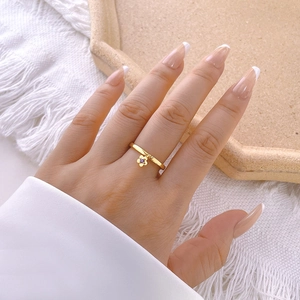 Exquisite 18k gold plated flower ring with purple zircon stone on a model hand