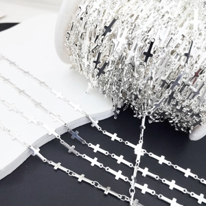 Detailed view of silver cross chain links for DIY jewelry making and craft projects