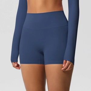 Detailed close-up of high-waist dark blue yoga shorts featuring seamless firm compression