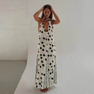 Deep V-neck backless halter dress with black and white polka dot patchwork pattern