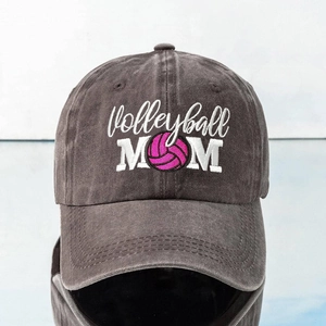 Washed dark gray baseball cap with embroidered Volleyball MOM text and pink ball icon