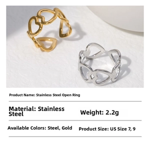 Detail of hollow heart-shaped stainless steel open rings in gold and silver finish