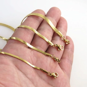 Four 18k gold plated stainless steel snake bone chain bracelets with lobster clasps