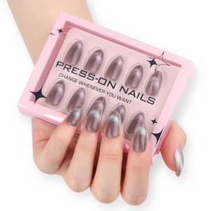 Cat eye almond press-on nails in greyish purple with glitter finish and packaging