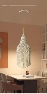 Detailed view of handmade bohemian cotton rope lampshade with diamond weave and tassels