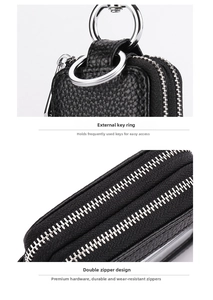Macro view of double zipper details and silver metal ring on black leather key pouch