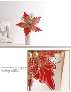 Detail of red and gold Christmas flower with mesh petals, glitter edges, and festive decor