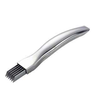 Golden stainless steel scallion shredder with ergonomic handle on white background