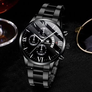 Close-up of black steel quartz watch with Roman numerals and three sub-dials on textured background