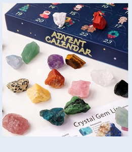 Close-up of 24-day Christmas advent calendar box with various natural crystal gemstones