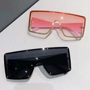 Fashionable oversized wrap-around sunglasses with metal rivets in pink and black frames