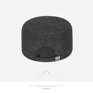 Rear view of winter wool flat top cap in dark grey with adjustable metal buckle strap