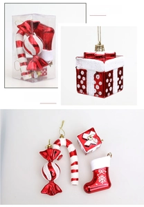 Close-up of red and white glitter Christmas ornaments including candy canes and boots