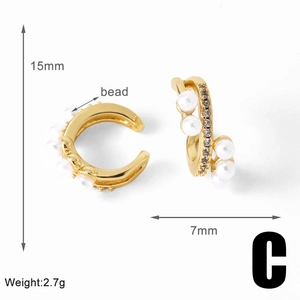Detail of 15mm gold-plated ear cuff featuring pavé cubic zirconia and white beads