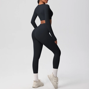 Slim fit black yoga set with long sleeve crop top and high waist leggings side view