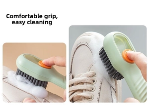 Detail showing the ergonomic grip and foam cleaning of the soft bristle shoe brush.
