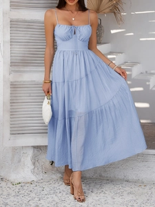 Close-up of light blue layered maxi dress with cutout bodice and lace-up details