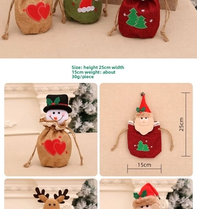 Detailed view of Christmas drawstring gift bags featuring snowman and Santa designs