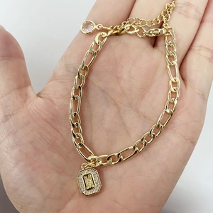 Gold plated Figaro chain bracelet with crystal letter M pendant and adjustable clasp