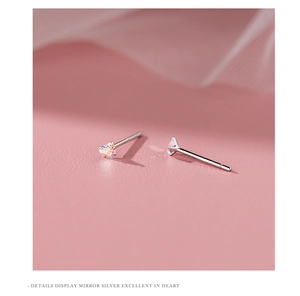 Detailed macro view of S925 sterling silver heart stud earrings with iridescent zircon stone