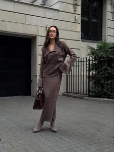 Detail of dark coffee knit two-piece set with V-neck cardigan and matching long skirt