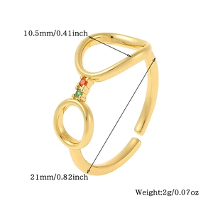 Detail showing gold geometric ring with zircon stones and adjustable open sizing