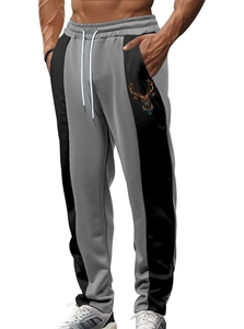 Detail of men's color-block jogger featuring a geometric deer print on the side pocket