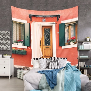 Detail of bohemian tapestry featuring Mediterranean architecture with orange walls and green shutters