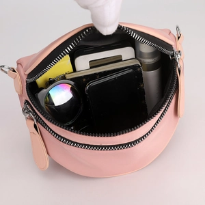Pink PU leather shoulder bag with spacious interior and multiple compartments for storage
